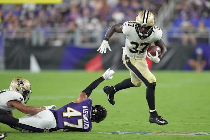 New Orleans Saints running back Tony Jones Jr. (37) runs for a gain defended by Baltimore Ravens safety Ar Darius Washington (47). Mandatory Credit: Mitch Stringer-USA TODAY